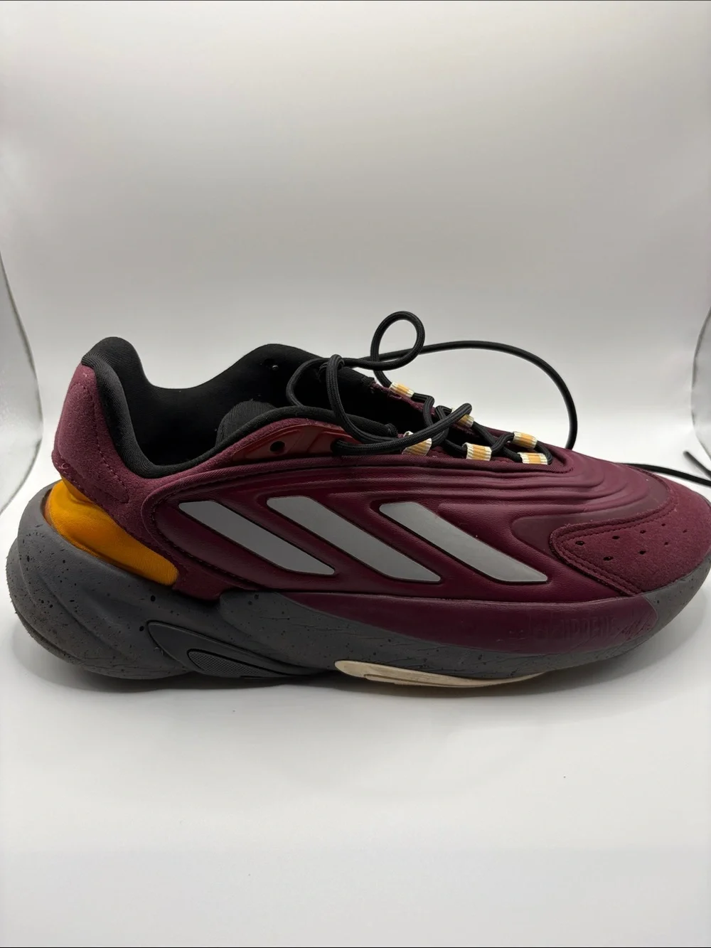adidas OZELIA Men’s Burgundy and Black Running Sneaker with Yellow Accents